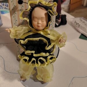 Adorable Doll with Yellow and Black Ruffles
